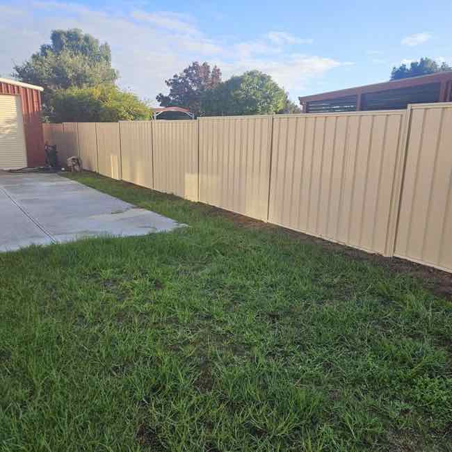 Cream colorbond fence
