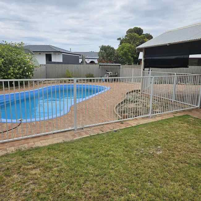 black tubular pool fence