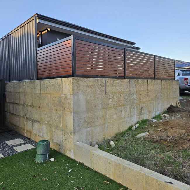Retaining wall with fence